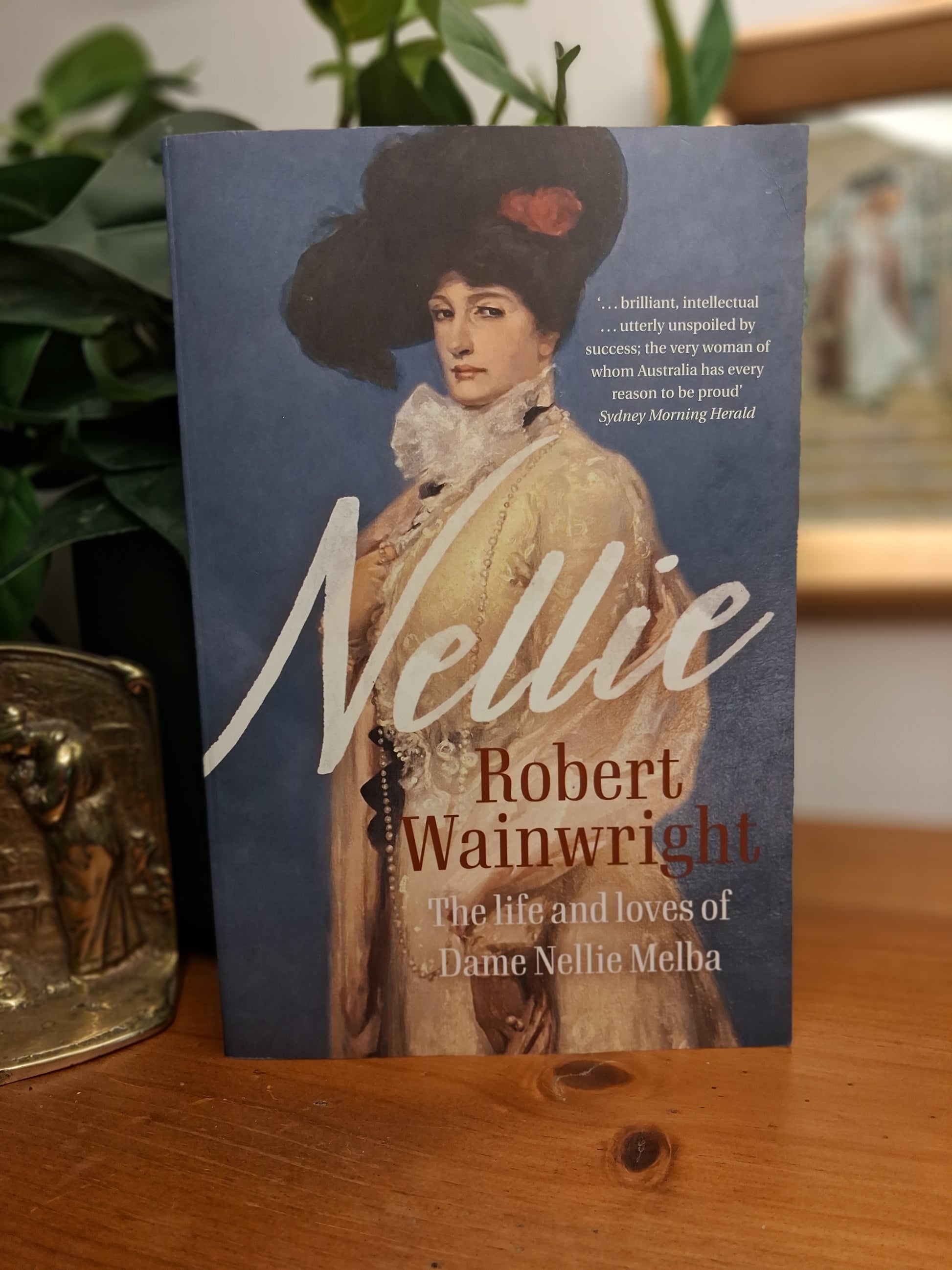 Cover of Nellie: The Life and Loves of Dame Nellie Melba by Robert Wainwright, a biography of Australia's legendary opera singer.
