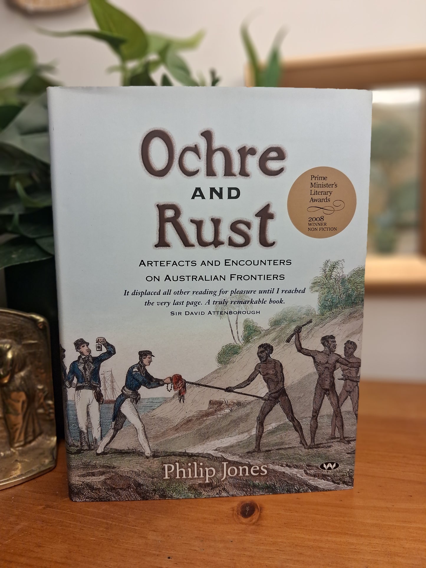Cover of Ochre and Rust by Philip Jones, a hardcover study of artefacts and encounters on Australian frontiers.