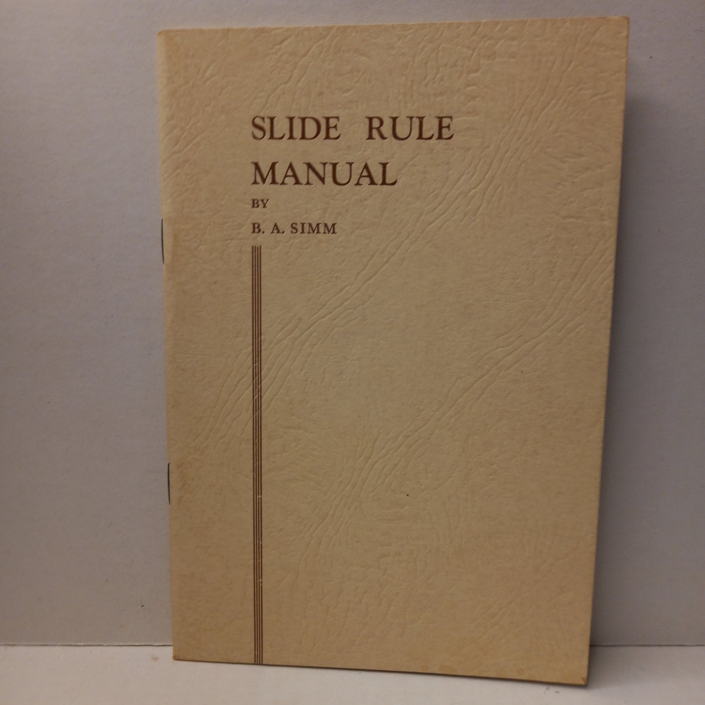 Slide rule manual : a text book for use with standard types of slide rules by B.A. Simm-Book-Tilbrook and Co