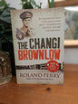 Cover of The Changi Brownlow by Roland Perry, a World War II history of Australian prisoners of war and football in Changi.